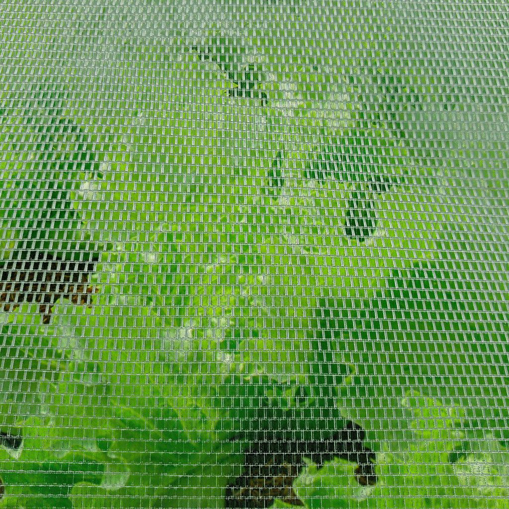 A close-up view of a mesh anti-insect screen with a focus on its texture and weave.